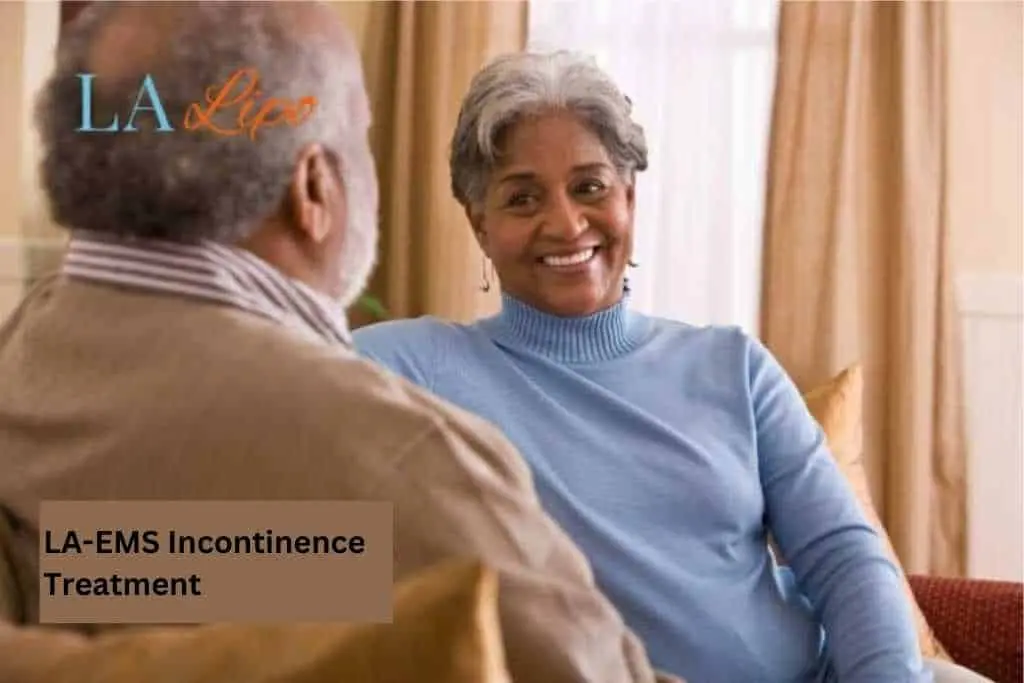 Couple sat smiling at each other - LA-EMS treatment Guildford