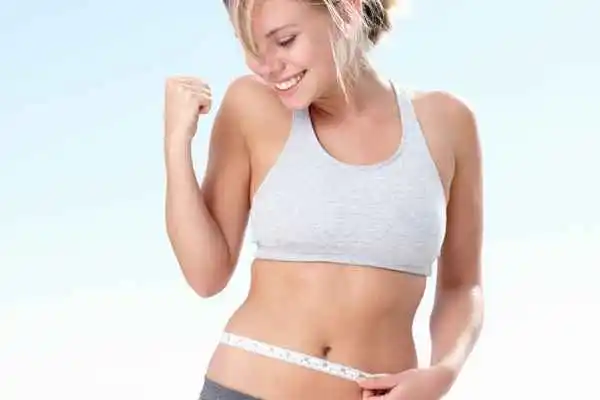 woman happy after fat reduction treatment Guildford