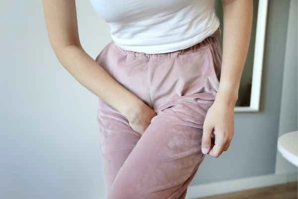 woman struggling with urine incontinence Guildford